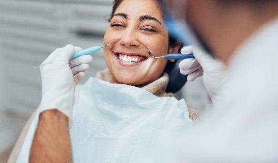 dental cleanings boise | woman at dentist