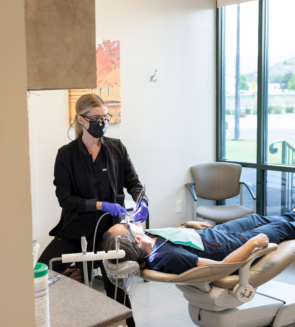 Innerbloom Dental Studio | a dentist performing a cleaning